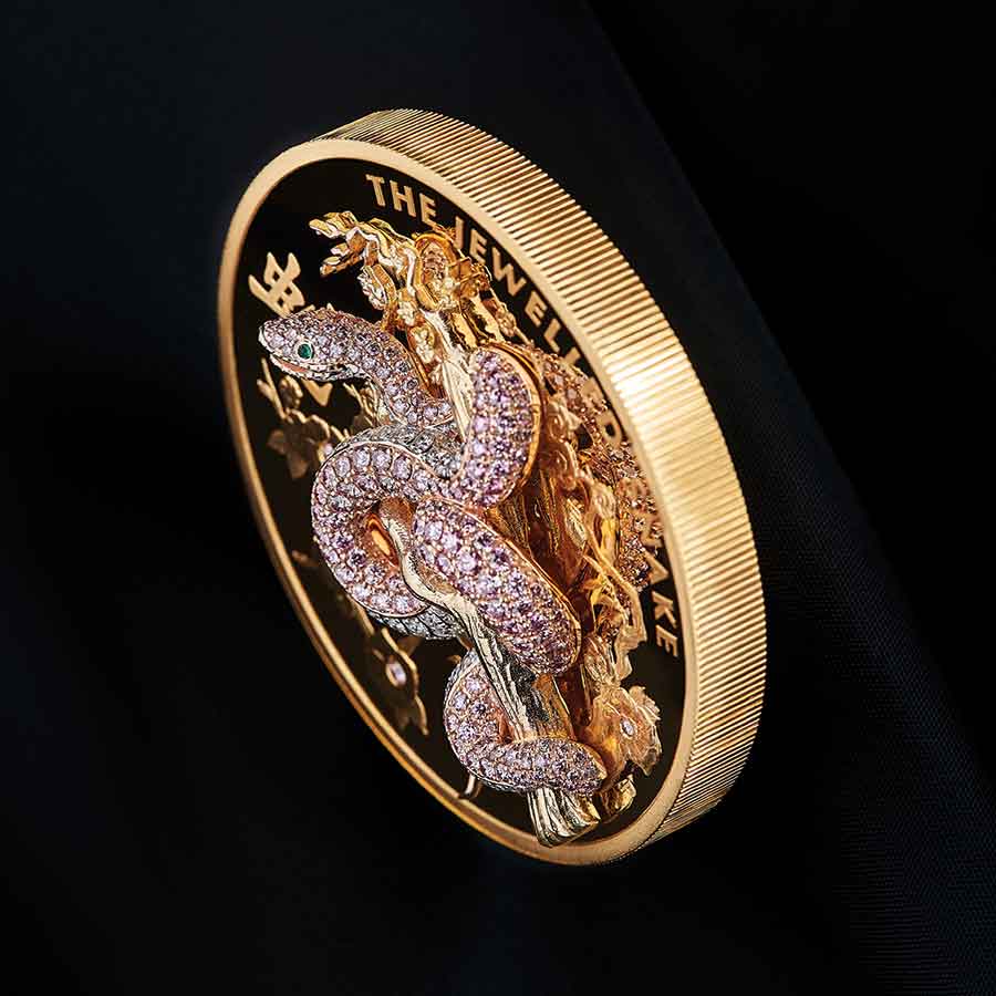 13-The-Jewelled-Snake-10oz-Gold-Proof-Coin-Stood-Up-Mood-Black-Background-HighAngle-HighRes 2023 Jewelled Snake 10 oz Pave Pink Diamond Gold Proof Coin